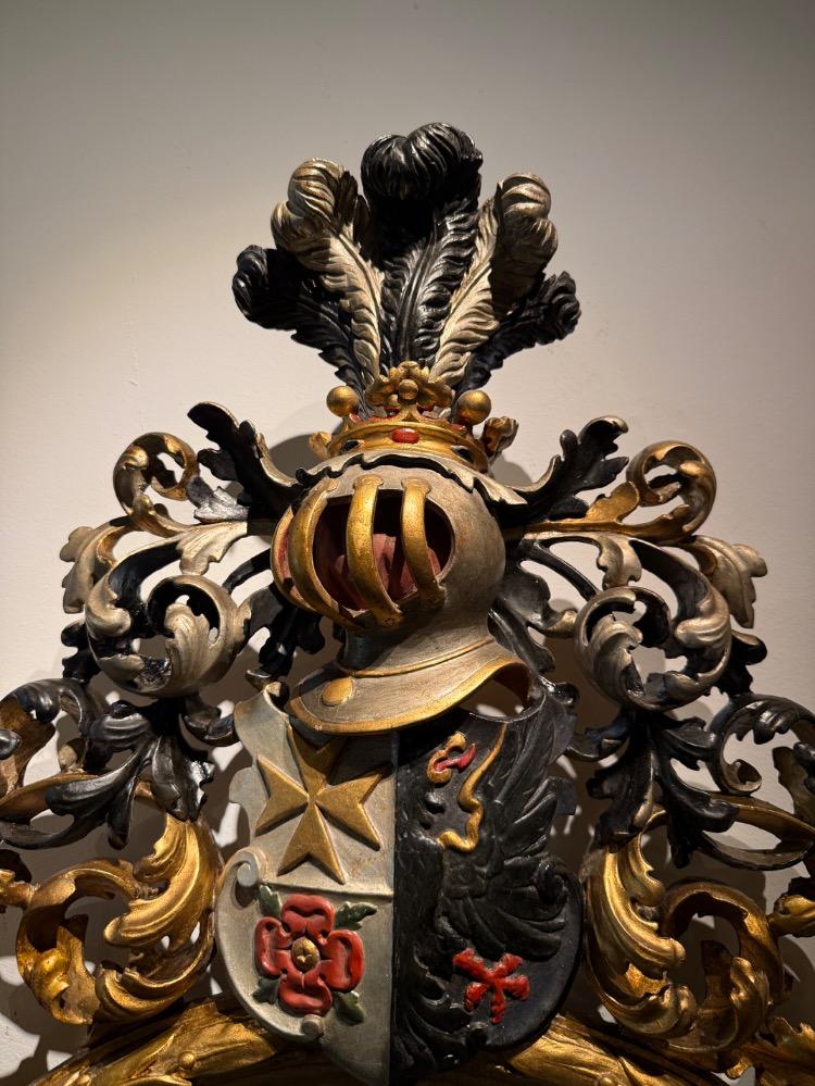 A 19th Century Baroque Revival oval mirror. 