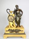 A 19thC. Empire ormolu and patinated bronze mantel clock representing Asclepius