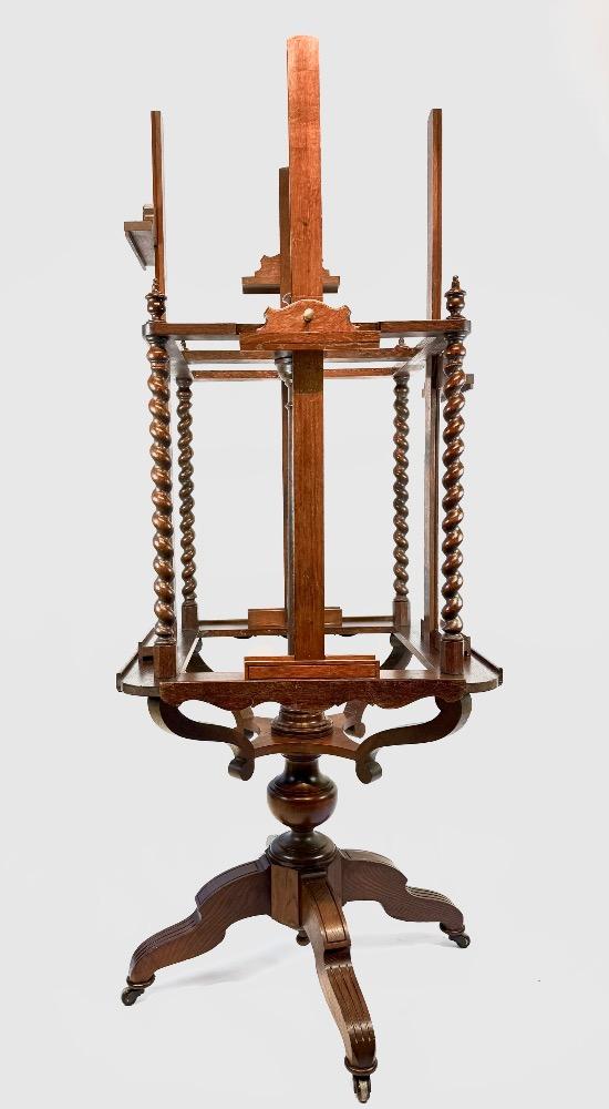 A 19thC. oak four-sided revolving presentation easel.