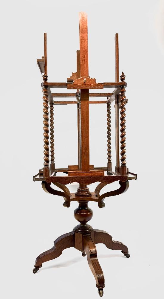 A 19thC. oak four-sided revolving presentation easel.