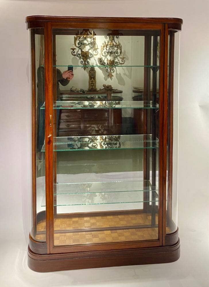 A bow ended display cabinet. 