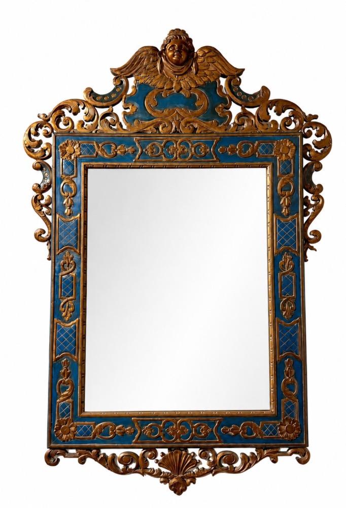 A carved and gilded wooden mirror. 
