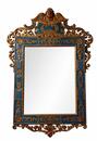 A carved and gilded wooden mirror. 