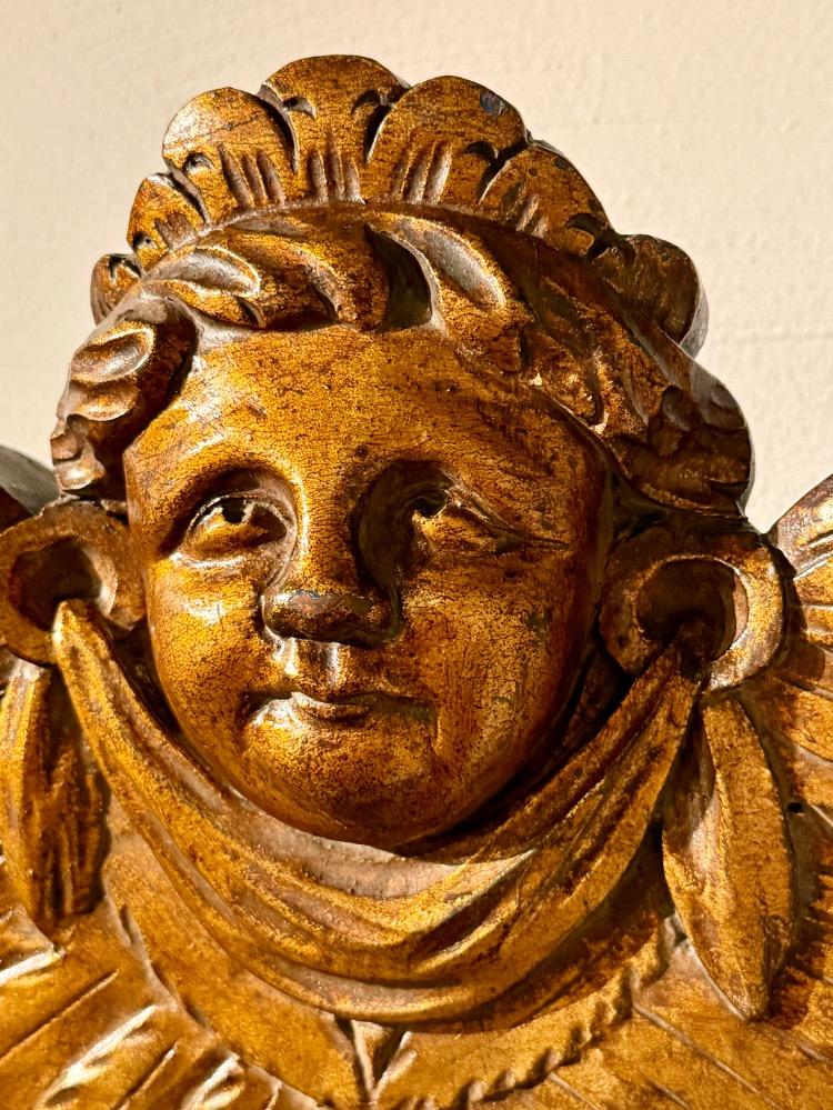 A carved and gilded wooden mirror. 