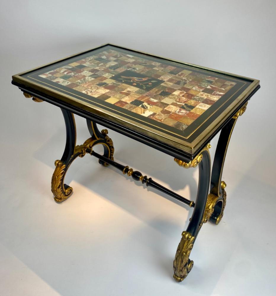 A fine Italian early 19th century ebonized mahogany and polychrome table with Pietra Dura and Specimen marble top   