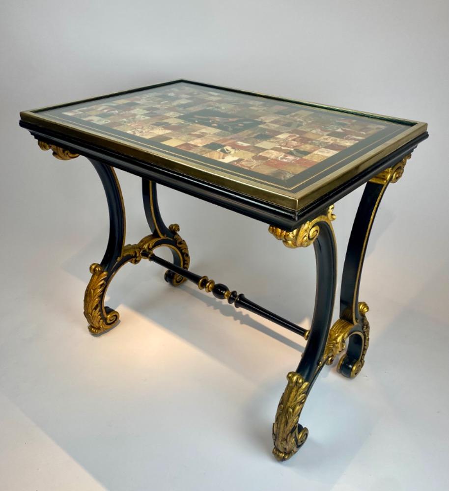 A fine Italian early 19th century ebonized mahogany and polychrome table with Pietra Dura and Specimen marble top   