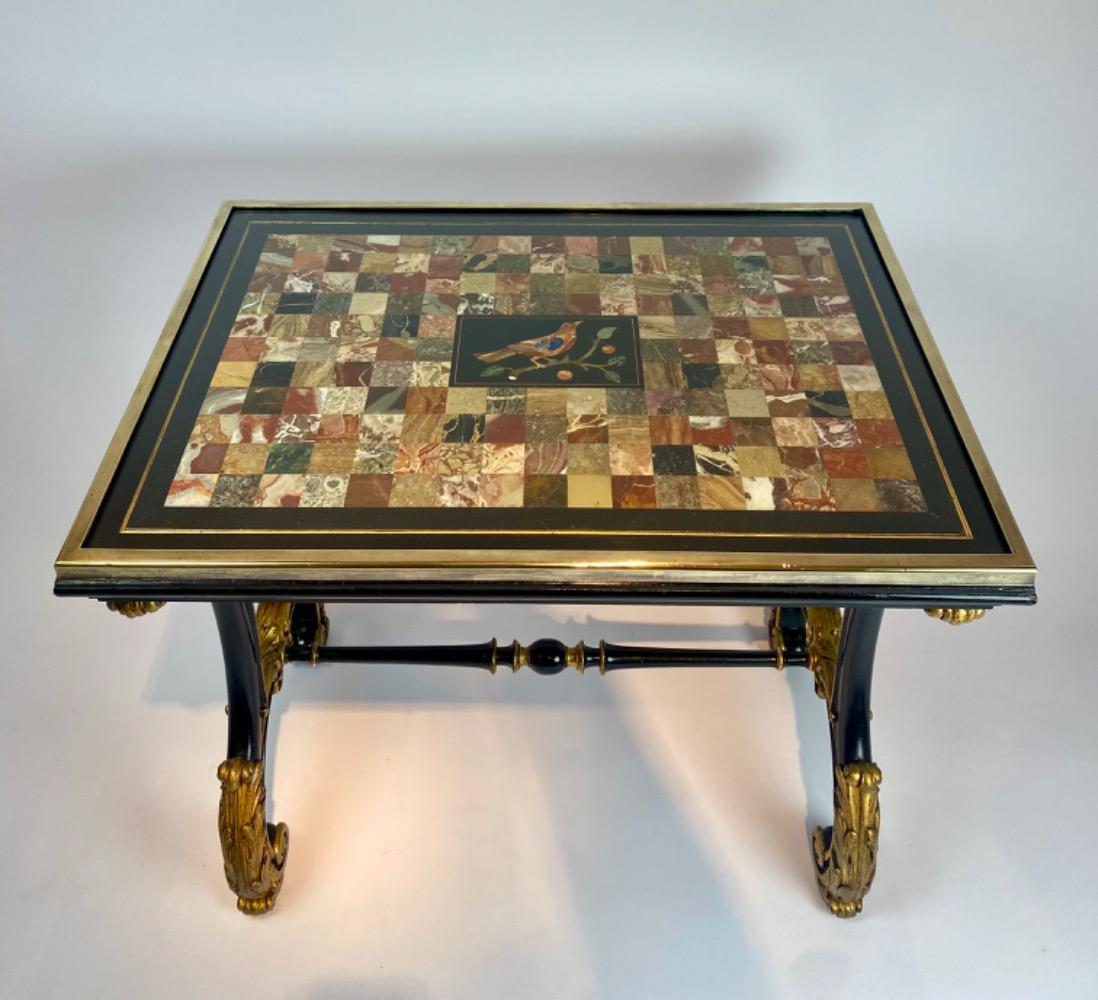 A fine Italian early 19th century ebonized mahogany and polychrome table with Pietra Dura and Specimen marble top   