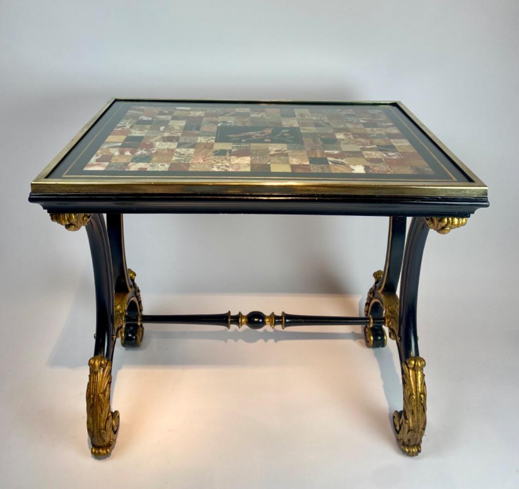 A fine Italian early 19th century ebonized mahogany and polychrome table with Pietra Dura and Specimen marble top   