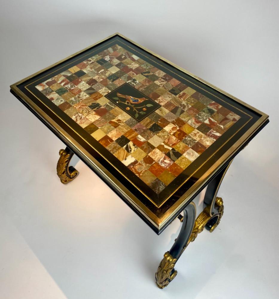 A fine Italian early 19th century ebonized mahogany and polychrome table with Pietra Dura and Specimen marble top   