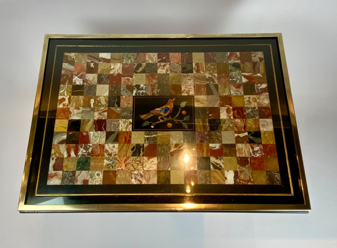 A fine Italian early 19th century ebonized mahogany and polychrome table with Pietra Dura and Specimen marble top   