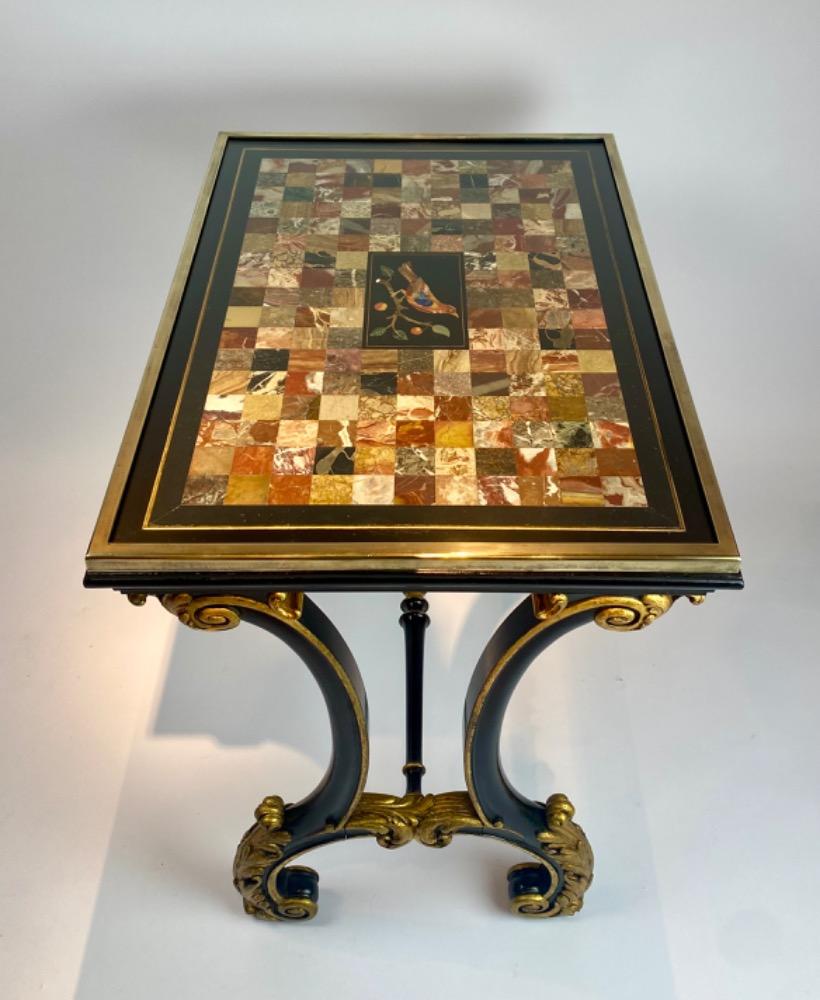 A fine Italian early 19th century ebonized mahogany and polychrome table with Pietra Dura and Specimen marble top   