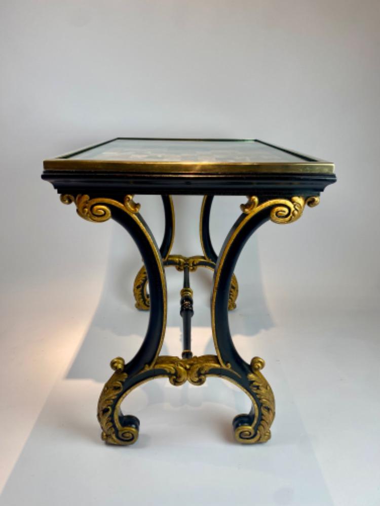 A fine Italian early 19th century ebonized mahogany and polychrome table with Pietra Dura and Specimen marble top   