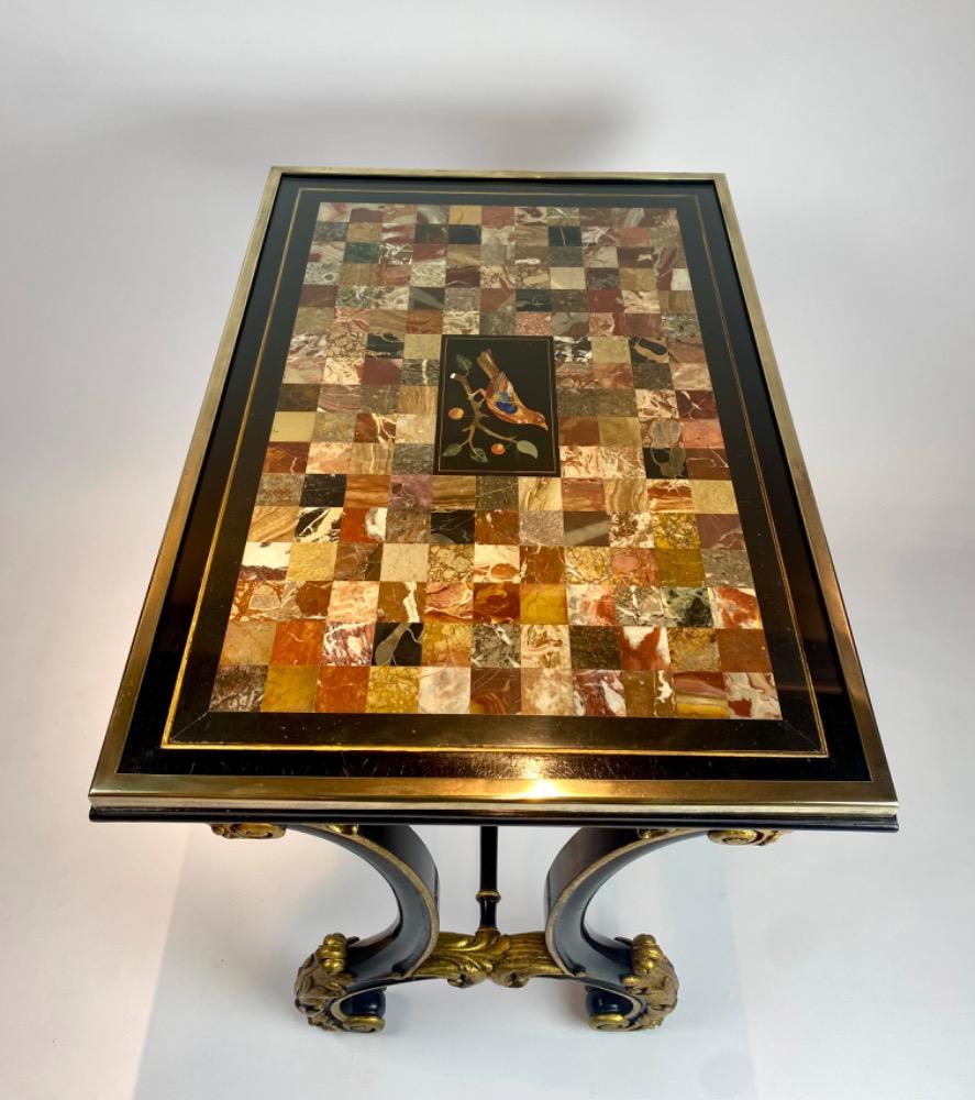 A fine Italian early 19th century ebonized mahogany and polychrome table with Pietra Dura and Specimen marble top   