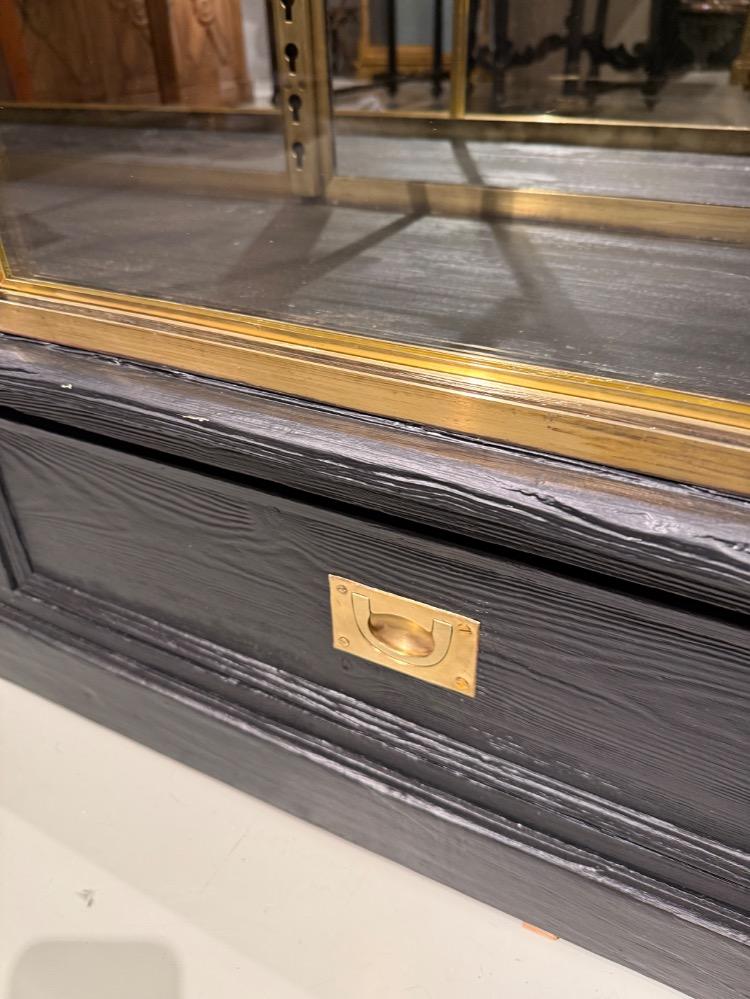 A large brass display cabinet