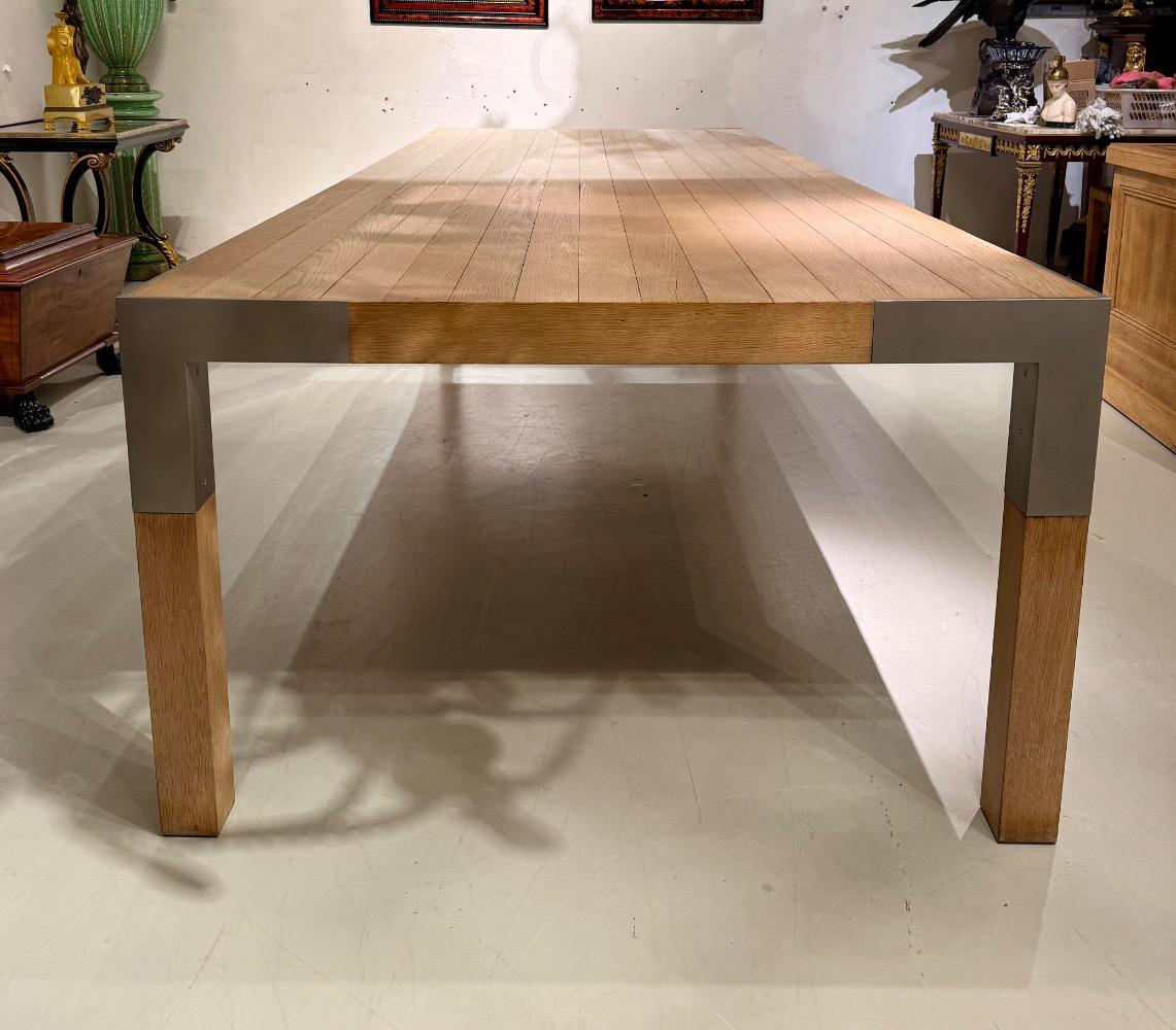A LARGE DINING TABLE DESIGNED BY CLAIRE BATAILLE AND PAUL IBENS.