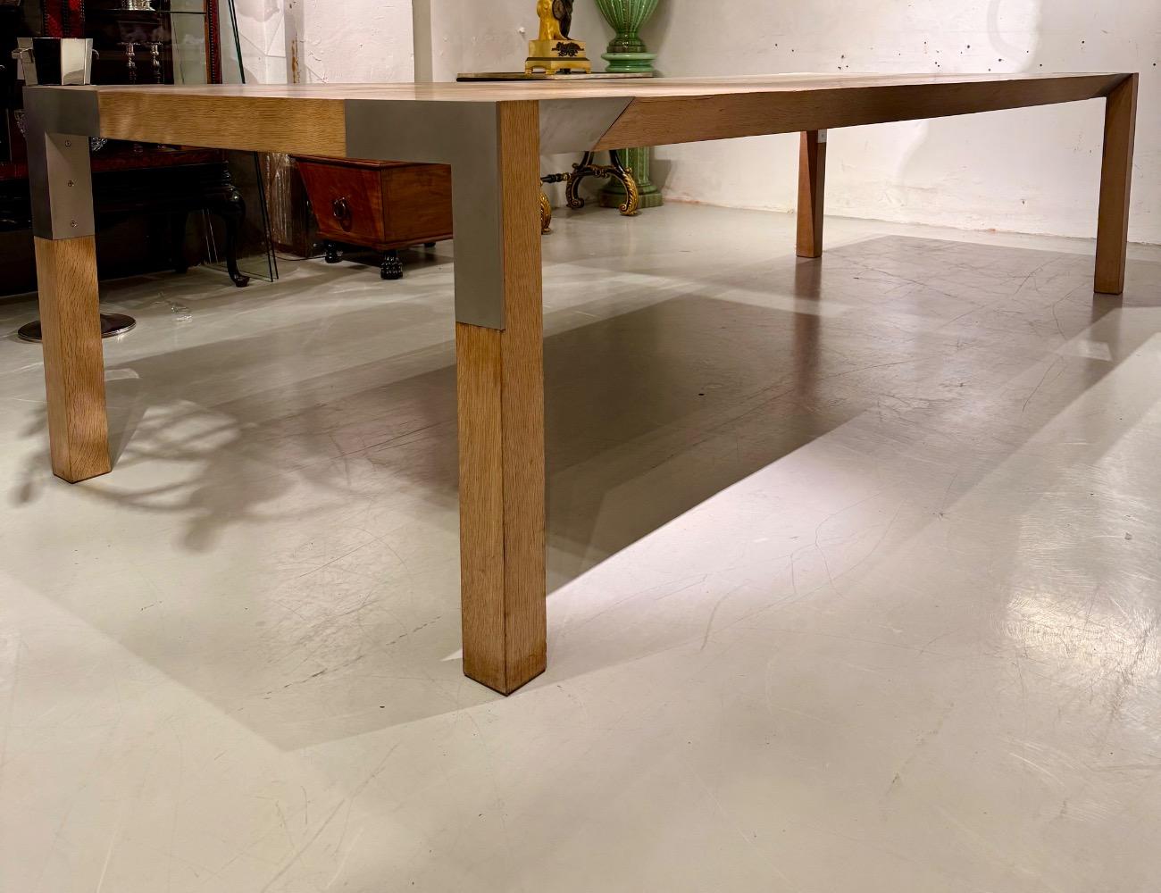 A LARGE DINING TABLE DESIGNED BY CLAIRE BATAILLE AND PAUL IBENS.