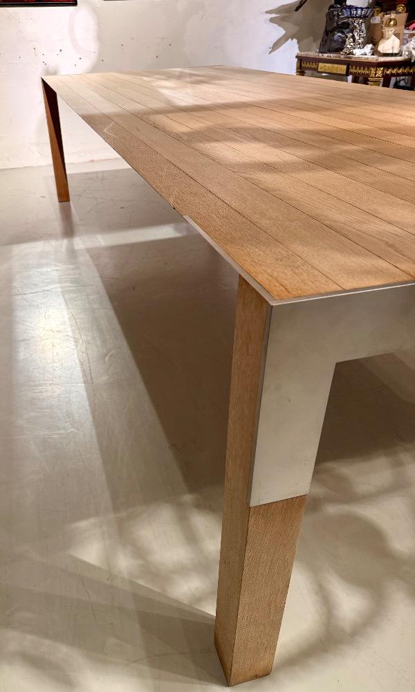 A LARGE DINING TABLE DESIGNED BY CLAIRE BATAILLE AND PAUL IBENS.