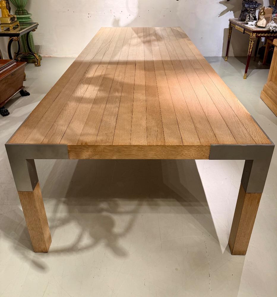 A LARGE DINING TABLE DESIGNED BY CLAIRE BATAILLE AND PAUL IBENS.