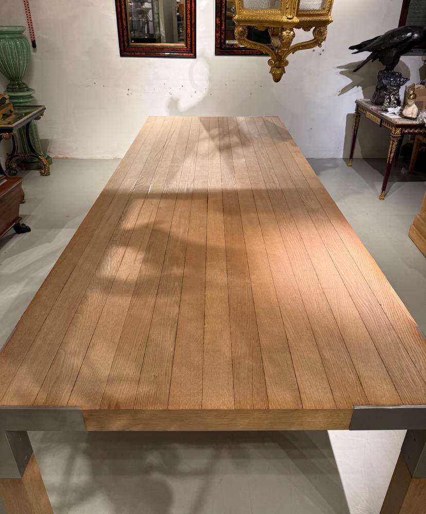 A LARGE DINING TABLE DESIGNED BY CLAIRE BATAILLE AND PAUL IBENS.