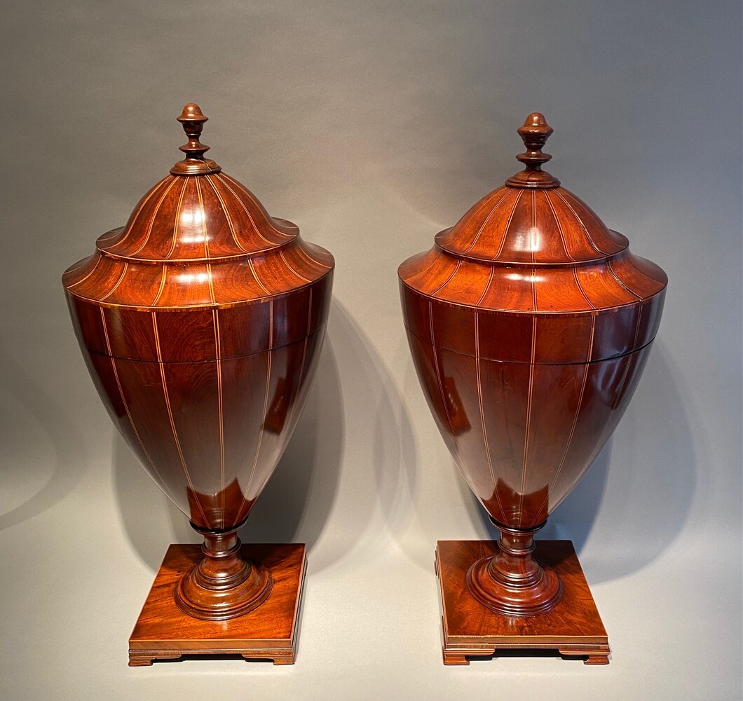 A large matched pair of English mahogany urns 