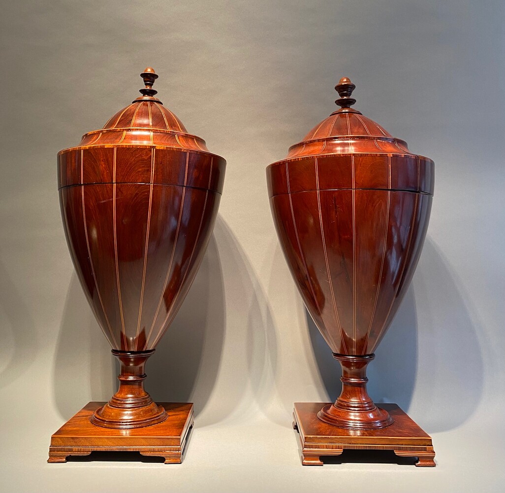 A large matched pair of English mahogany urns 