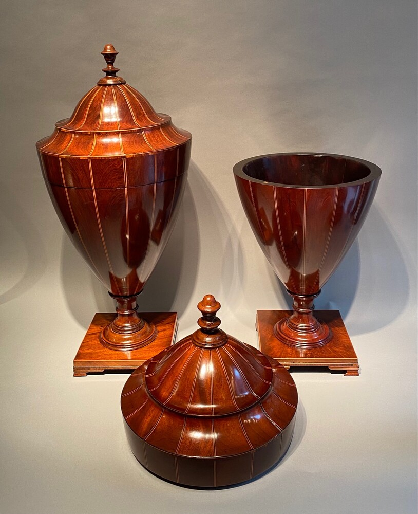 A large matched pair of English mahogany urns 