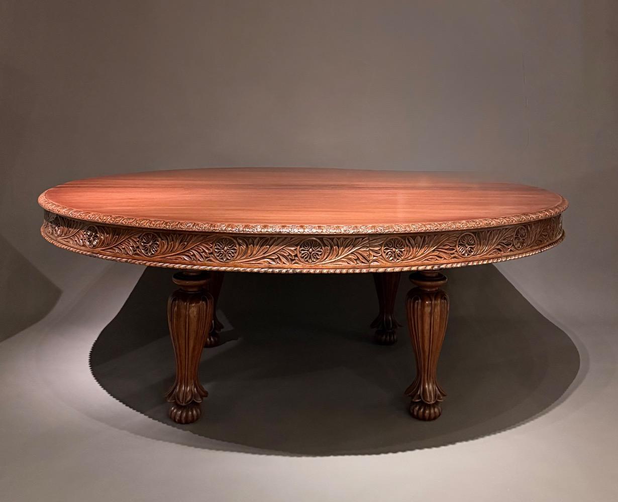 A large round dining table. 12 persons. 