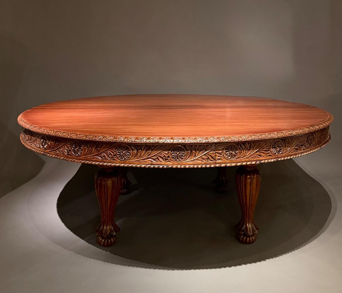 A large round dining table. 12 persons. 