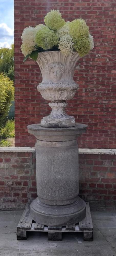 A large stone garden  pedestal
