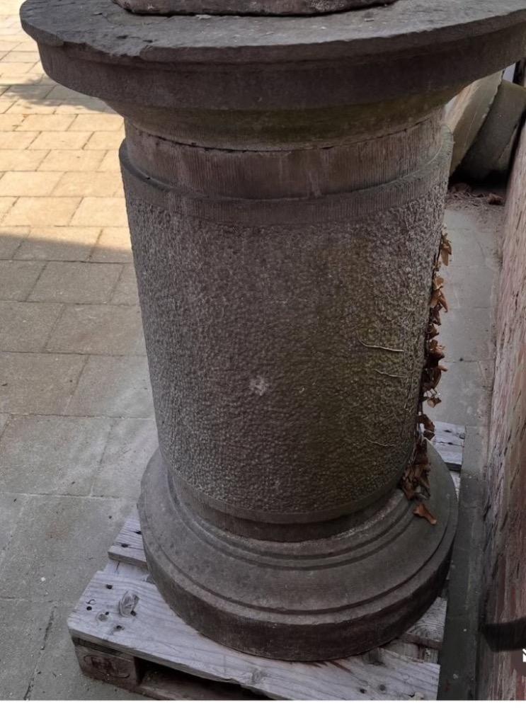 A large stone garden  pedestal