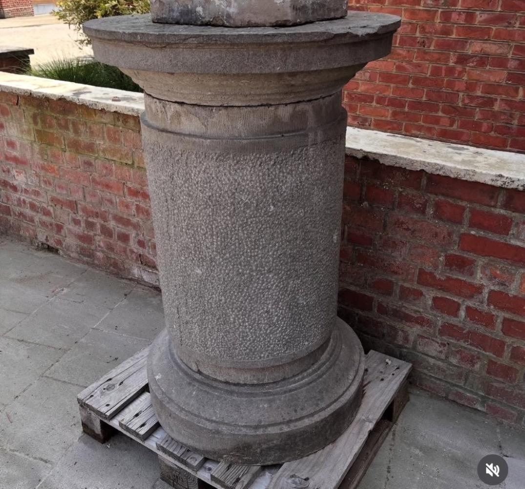 A large stone garden  pedestal