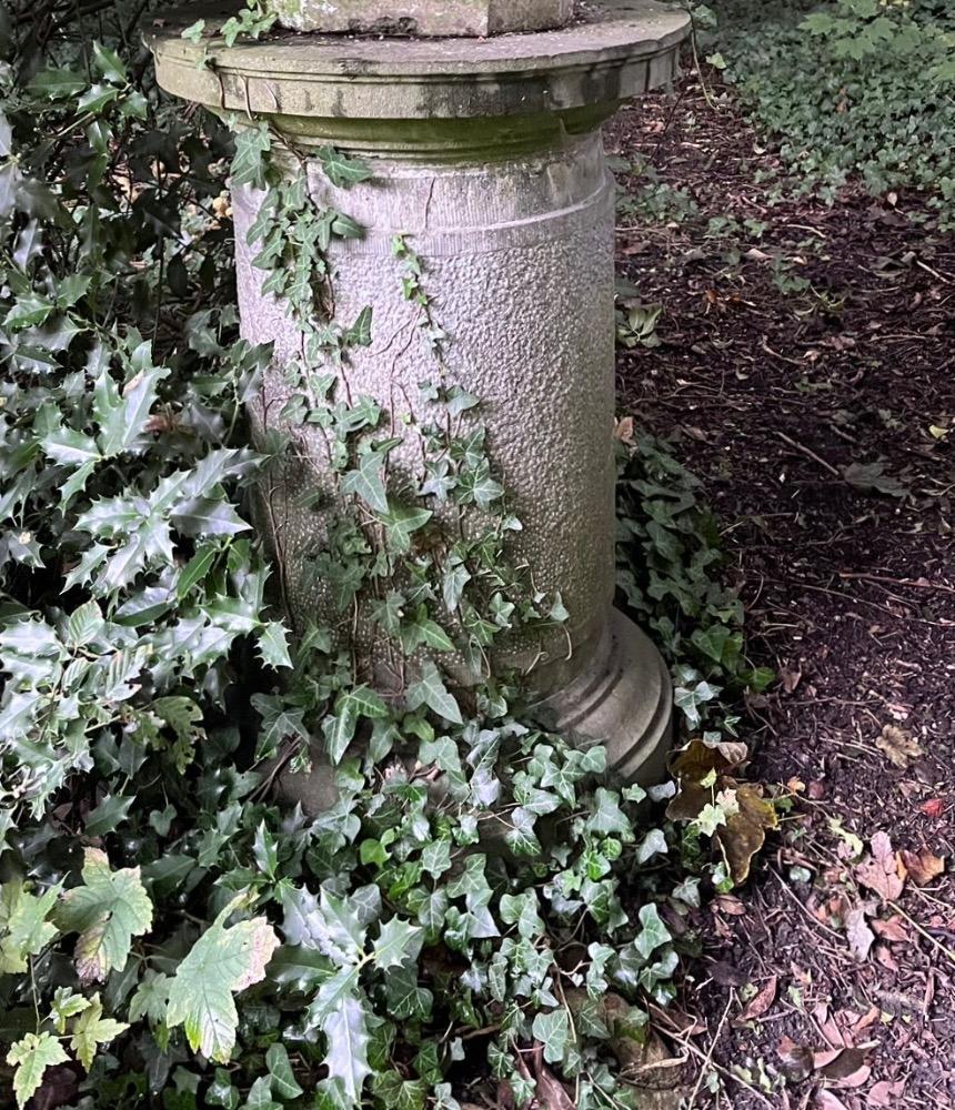 A large stone garden  pedestal
