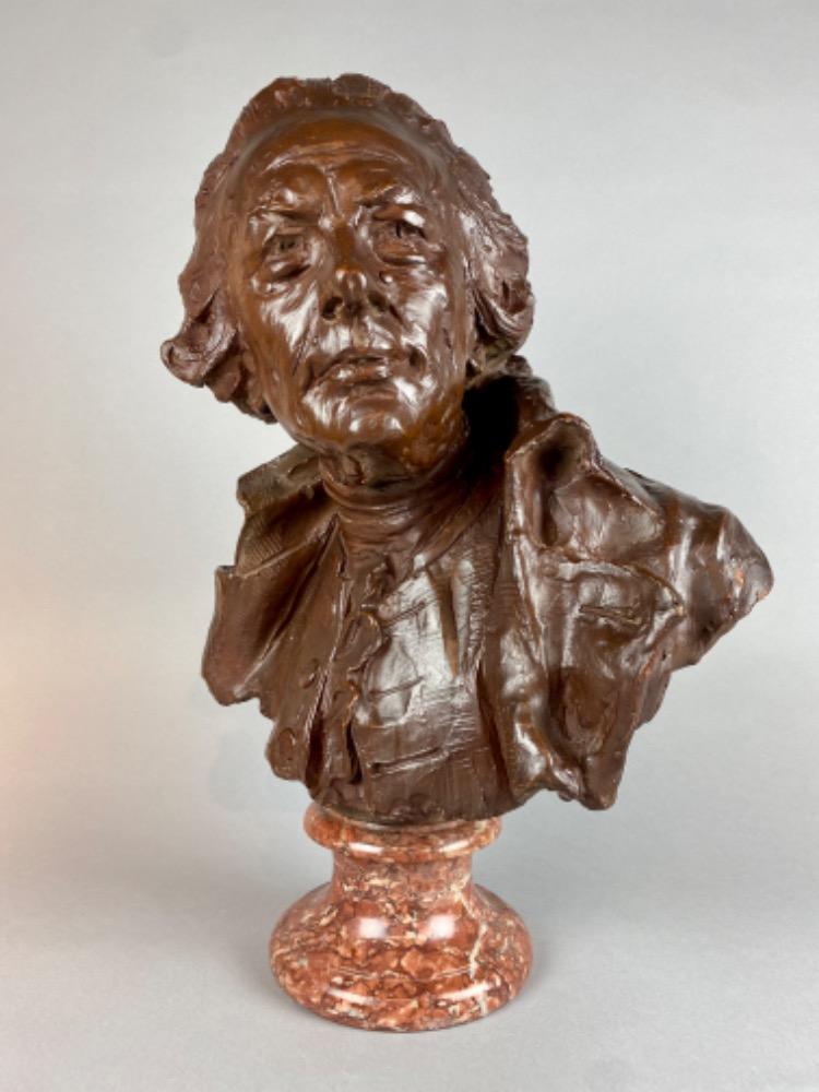 A late 18thC. terracotta bust of a gentleman. 