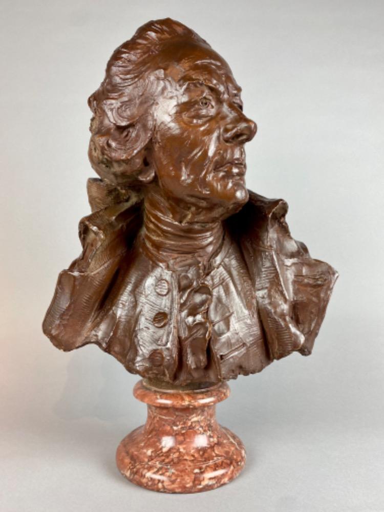 A late 18thC. terracotta bust of a gentleman. 