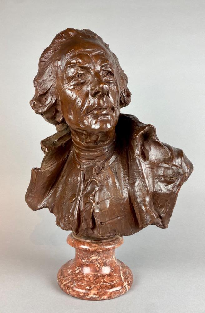 A late 18thC. terracotta bust of a gentleman. 