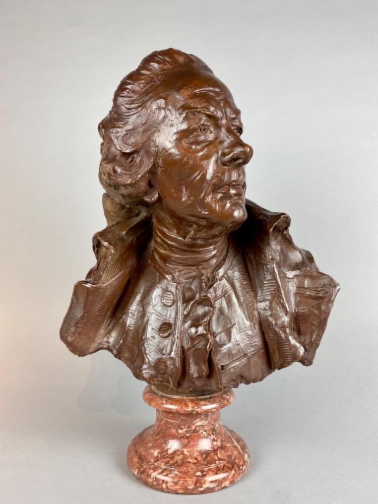 A late 18thC. terracotta bust of a gentleman. 