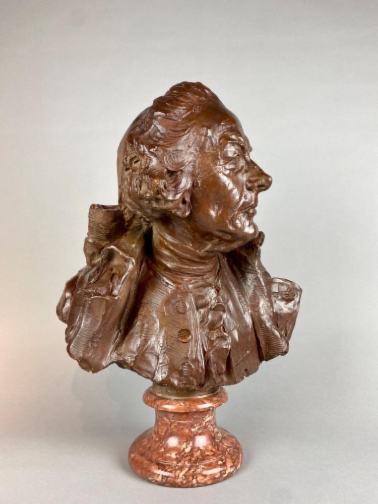 A late 18thC. terracotta bust of a gentleman. 