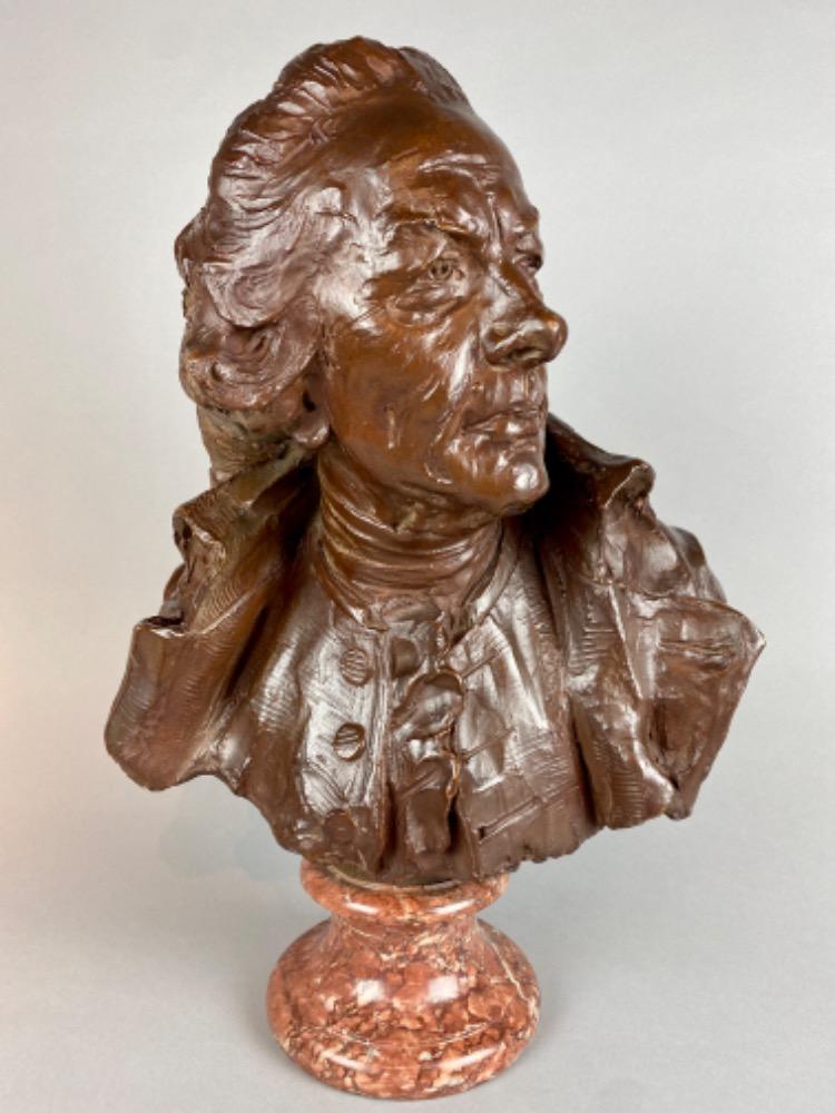 A late 18thC. terracotta bust of a gentleman. 