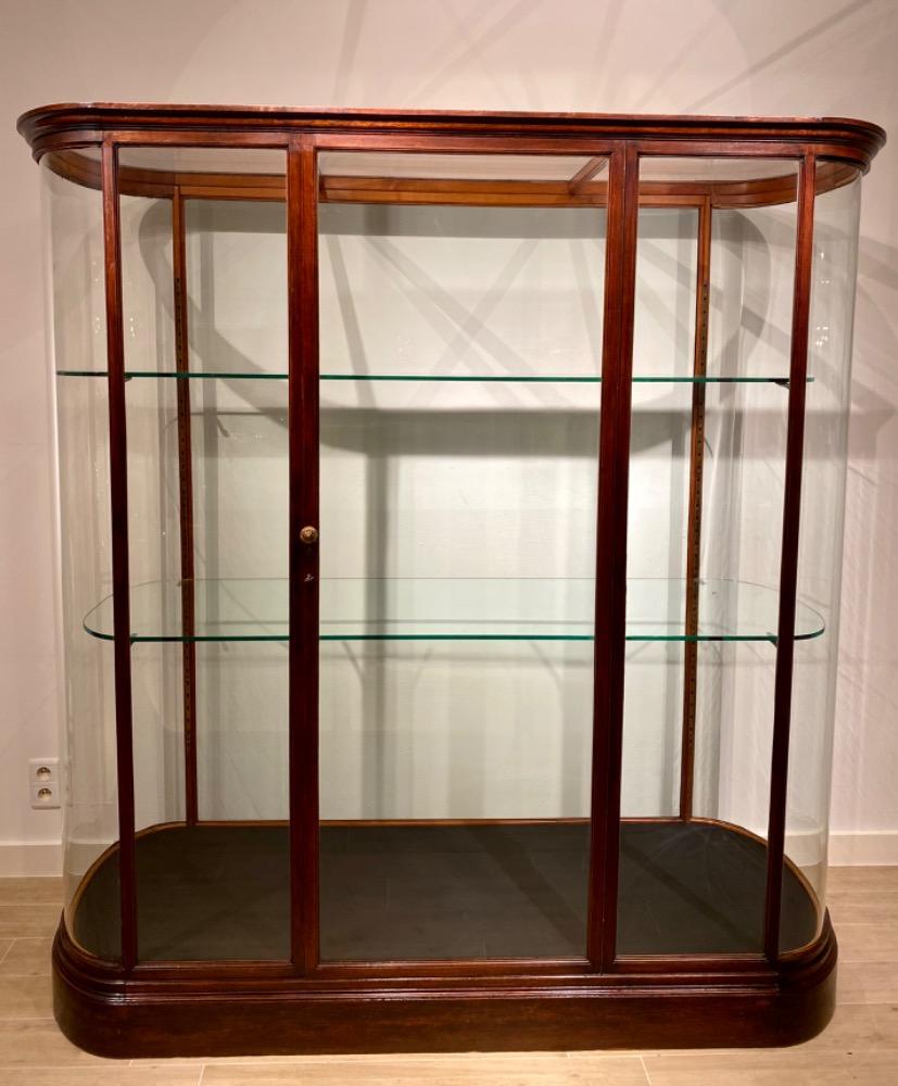 A late 19thC free standing mahogany display cabinet.