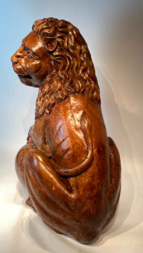 A life size carved lime wood Medici lion. 