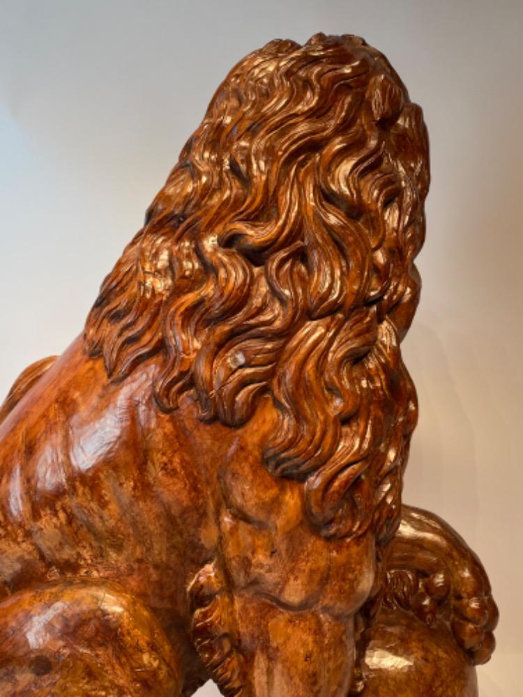 A life size carved lime wood Medici lion. 