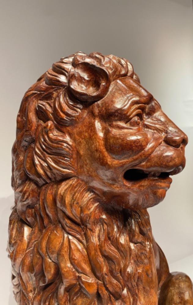 A life size carved lime wood Medici lion. 