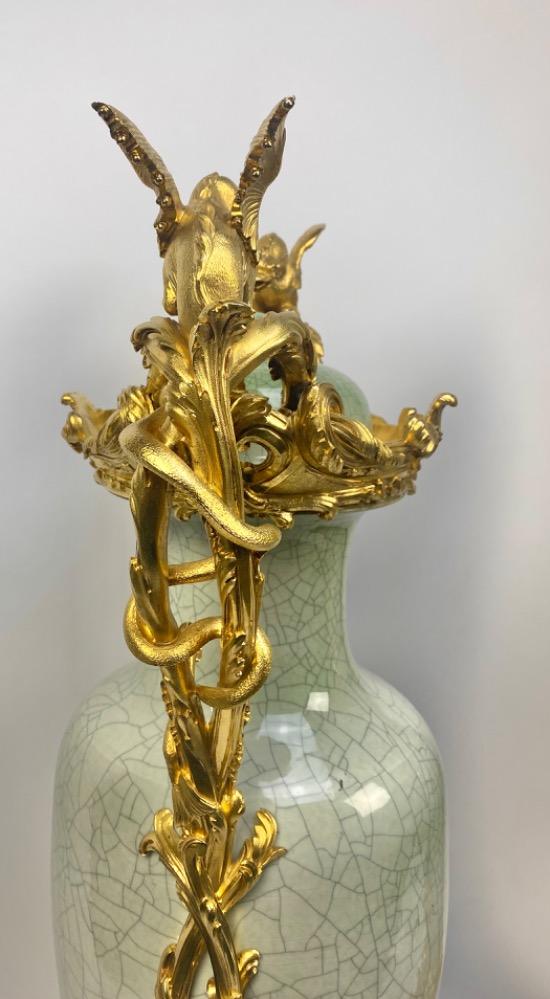 A pair of spectacular Chinese celadon porcelain vases with gilt bronze frames.