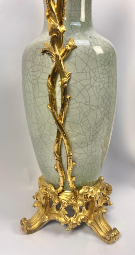 A pair of spectacular Chinese celadon porcelain vases with gilt bronze frames.