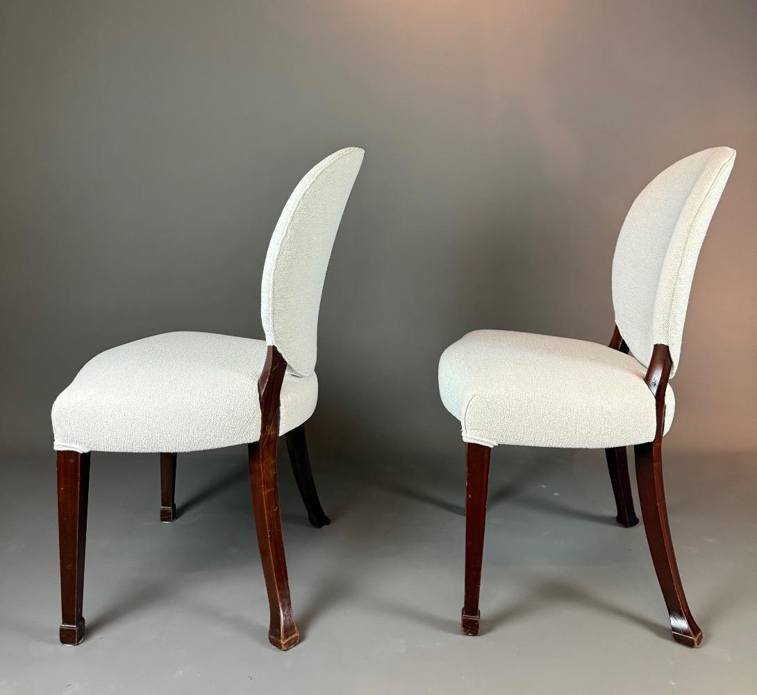 A set of 12 Regency Revival dining chairs. 