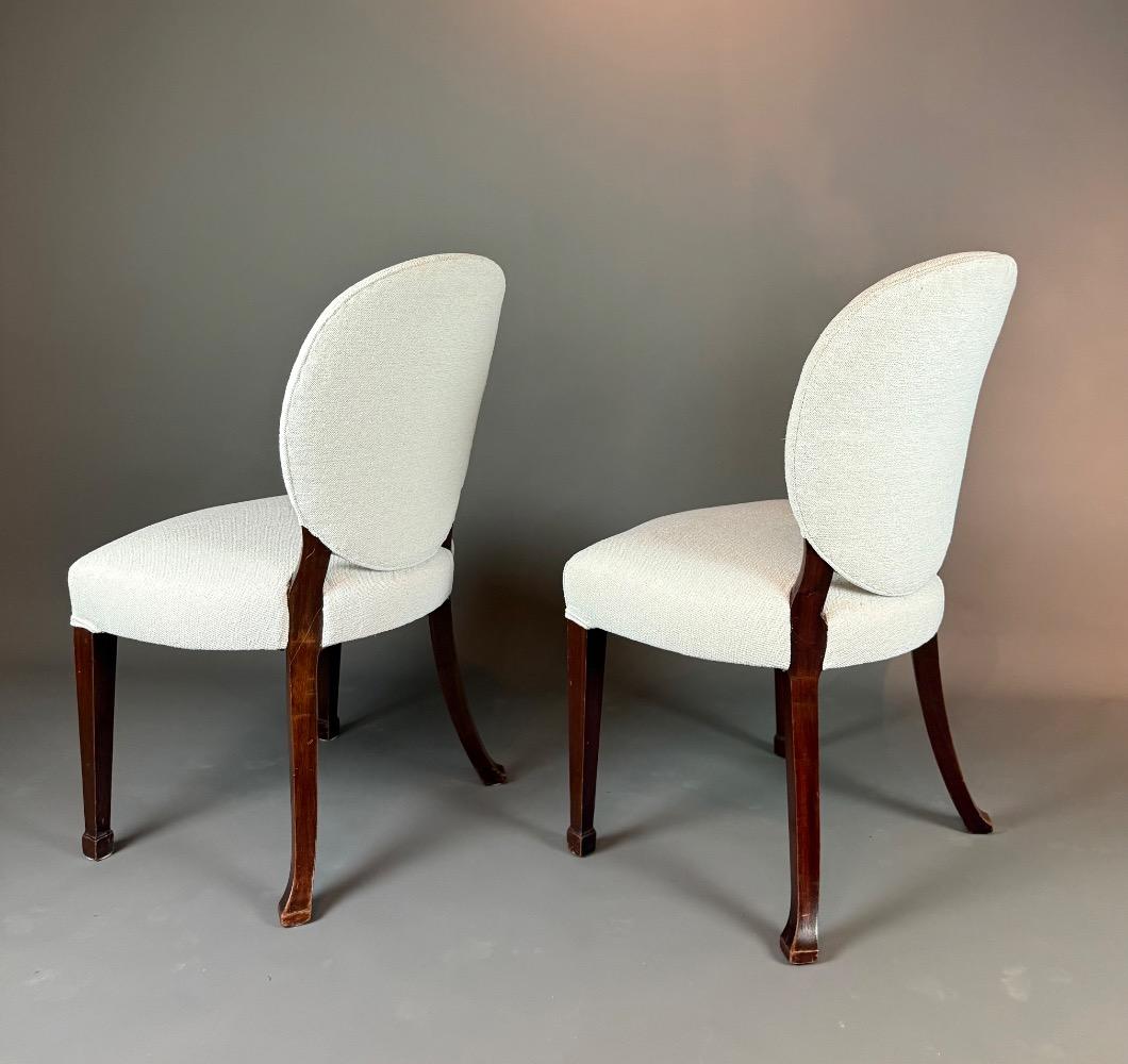 A set of 12 Regency Revival dining chairs. 