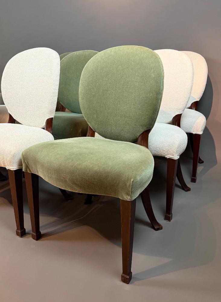 A set of 12 Regency Revival dining chairs. 