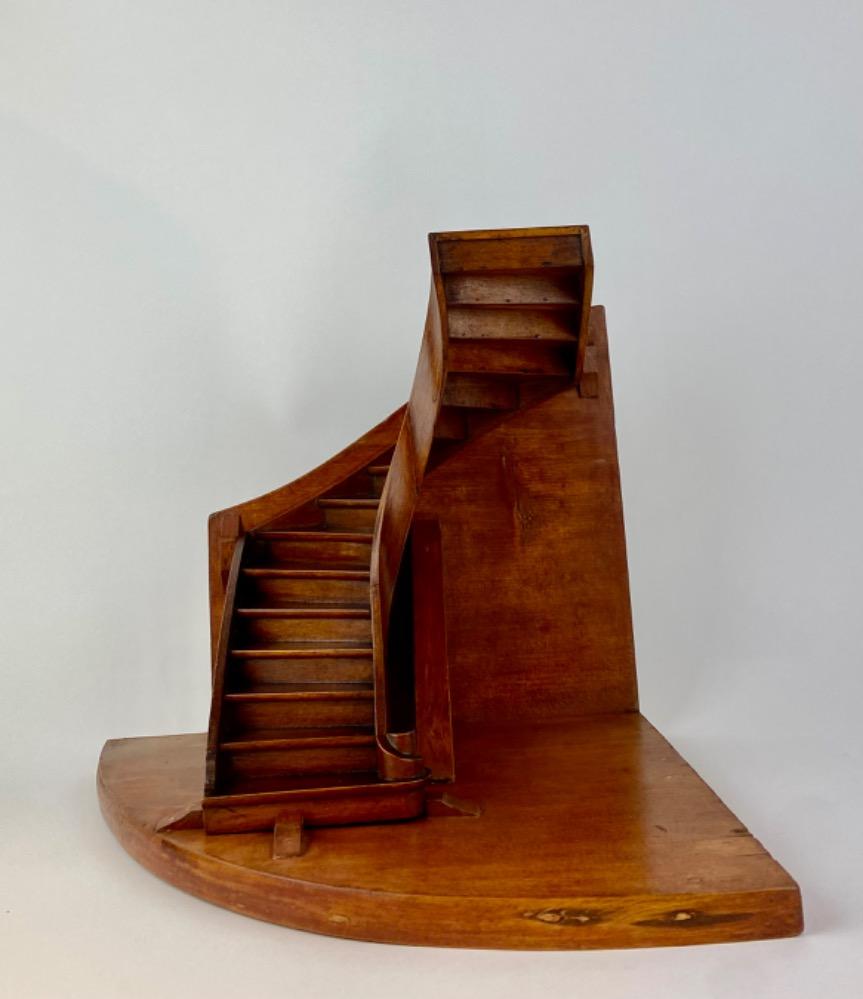 A stained beech wood staircase of mastery or 