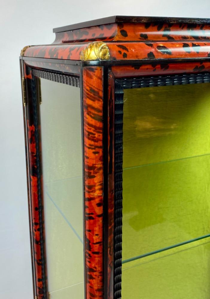 A tortoise shell vitrine by Maison Franck. 