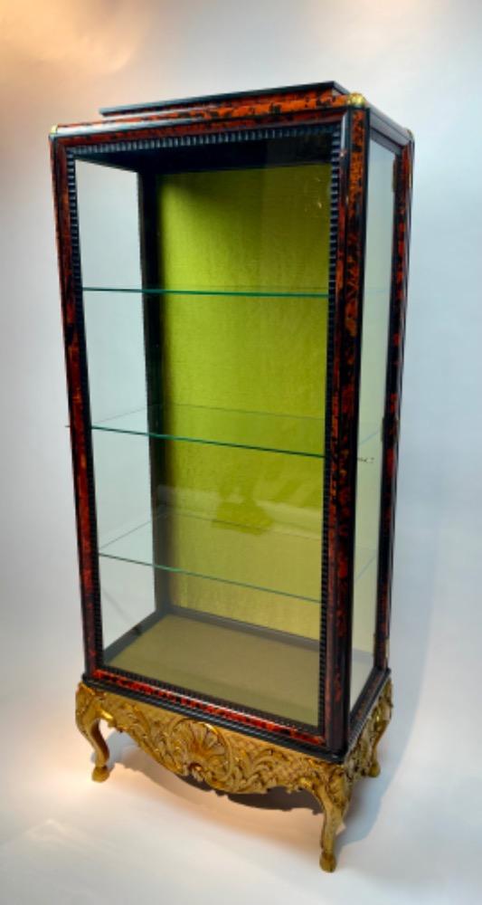 A tortoise shell vitrine by Maison Franck. 